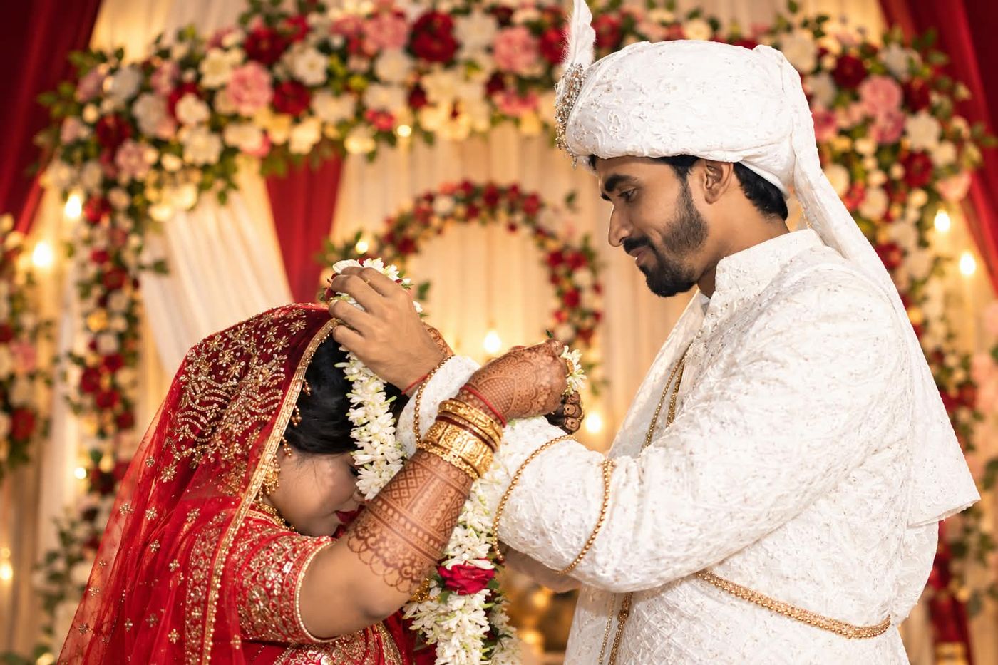 Sakil placing a garland on Tabassum during the wedding ceremony